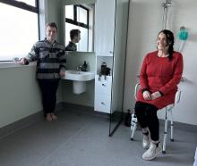 Alexandra woman Carla Hill and her son Nate check out the bathroom voluntarily remodelled by...