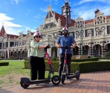 Michaela and Harman Gill, of Dunedin, test drive new Flamingo scooters ahead of their arrival in...