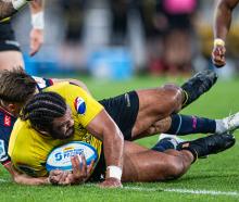 Pasilio Tosi of the Hurricanes dives over to score a try during the Super Rugby Pacific Quarter...