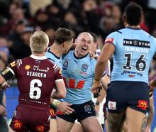 Dylan Edwards of the Blues celebrates after scoring a try in game two of State of Origin at the...