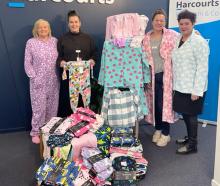 Admiring the new pyjamas donated by Harcourts Temuka to Arowhenua Whānau Services are (from left)...