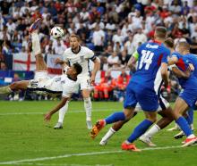 Jude Bellingham scored with a spectacular last-minute overhead kick to rescue England and send...