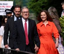 Britain's opposition Labour Party leader Keir Starmer and his wife Victoria walk outside a London...