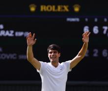 Carlos&nbsp;Alcaraz&nbsp;celebrates his victory over Novak Djokovic at Wimbledon. Photo: Reuters