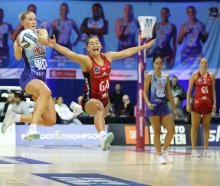 Mystics captain Michaela Sokolich-Beatson takes the ball as Tactix shooter Jess Allan tries to...