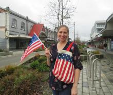 Lydia Maireriki proudly flies a US flag in celebration of Independence Day. Photo: Supplied