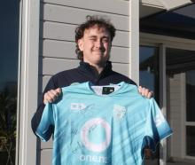 Invercargill teenager Jessie Sanford proudly shows the jersey he was given by New Zealand...