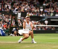 Lulu Sun celebrates after her win over Emma Raducanu on Wimbledon's Centre Court. Photo: Getty...
