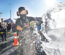 Victor Cagayat, of Auckland, in the car park at Blackwells Department store puts his ice...