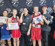 Bo-Dean Blackburn (centre) with some of her young up-and-coming boxers. PHOTO: SUPPLIED