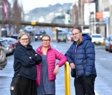 Dunedin city workers (from left) Jo Neilson, Antonia Wood and Steve Macknight discuss the removal...