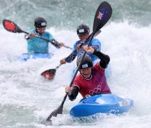 Finn Butcher competes in the first round of the kayak cross in Paris yesterday. PHOTO: GETTY IMAGES