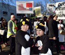 Dunedin sisters Maeva, 10, and Felicity, 8, Johnstone get ready to waddle around Dunedin to...