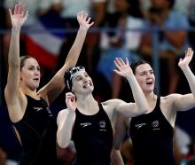 From left: Caitlin Deans, Eve Thomas and Erika Fairweather celebrate after their heat. Photo:...