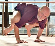With 50 years of yoga practice and teaching under his belt, Wayne Everson pushes into a bakasana ...