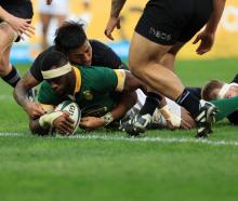 All Black Reiko Ioane can't stop South Africa captain Siya Kolisi from scoring a try. Photo:...