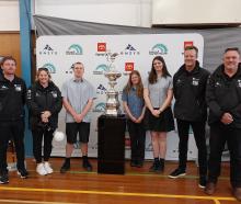 Posing with the America's Cup at Mount Aspiring College (MAC) on Tuesday afternoon are (from left...