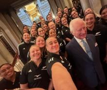 Britain's King Charles III poses for a photograph with members of New Zealand's Black Ferns rugby...