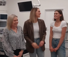 Melissa, Della (21) and Lilly (17) Vining check on progress inside the Southern Charity Hospital...