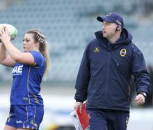 Otago Spirit coach Craig Sneddon is deep in thought as hooker Hannah Lithgow warms up before a...