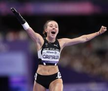 Anna Grimaldi celebrates her 100m bronze medal at the Paralympics. PHOTO: GETTY IMAGES