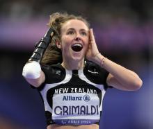 The moment Anna Grimaldi realised she won gold in the women's 200m T47 final. Photo: Getty Images 