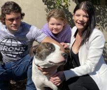 Quaid Brennan and Millie Russell, with Ariella Russell (8), said Onyx was a "loving dog". Photo:...