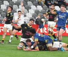 Otago openside flanker Lucas Casey shows his delight as he crosses for a try against Wellington...