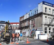 Contractors working on the empty section next door to the Crown Hotel in Rattray St. Photo: Peter...