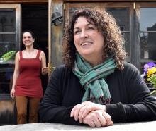 Robyne Saunders (centre) has sold Cafe Santosha, in Port Chalmers, to Sophia Clarke-Edwards who...