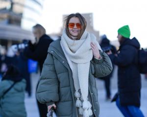 A guest wears a full-length khaki puffer jacket during the Copenhagen Fashion Week earlier this...