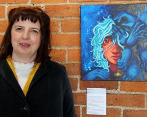 Community arts facilitator Rachel Taylor stands by the work  Headaches, overall winner of the...