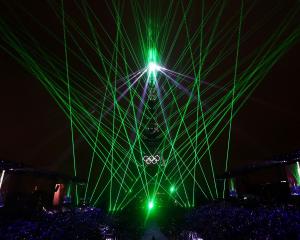 The Eiffel Tower is bathed in laser light. PHOTOS: REUTERS