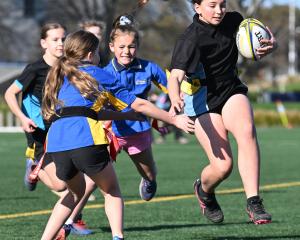 Valerie Beatson, 11, of Anderson’s Bay School, tries to beat the Strath Taieri defence. PHOTOS:...