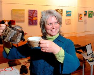 Judge Kim Pieters with a deerskin-covered tea set, Deer It Is, by Christchurch artist Tony...