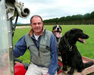 Southland farmer Jeff Grant, who is standing for the board of Alliance Group, at home with two...