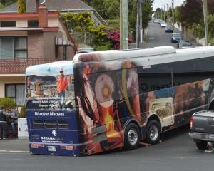 The tour bus ran aground while trying to negotiate a corner into Blacks Rd,on Saturday. Photo by...