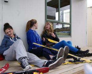 An ''injured'' Josey Jefferson (15), of Lauder, listens to her similarly injured friends Olivia...