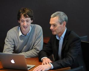 David Cameron (left) updates Altus Financial Services business and sales manager Jerry Pearse...