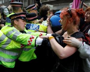 Demonstrators scuffle with police during a protest by the Occupy movement in London.  REUTERS...