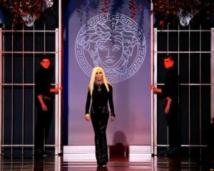 Donatella Versace acknowledges the audience at the end of the Versace Autumn/Winter 2014...
