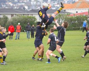 Dunedin lock Richard Thompson looses the support of his lifters while the Pirates forwards...