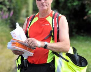 Dunedin posties organise the day's mail by street address before heading out on their deliveries....