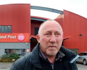 Engineering, Printing and Manufacturing Union organiser Mike Kirwood in front of the Dunedin mail...