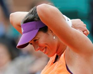 Garbine Muguruza enjoys a moment on her way to victory over Serena Williams. REUTERS/Jean-Paul...