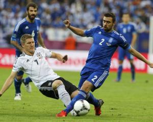 Germany's Bastian Schweinsteiger, left, will be on most shortlists for the team of the tournament...