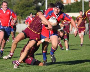 Harbour flanker Hadleigh May is cut down short of the line by Alhambra Union fullback Noah Cooper.