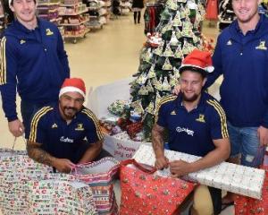 Highlanders (from left) Marty Banks, Ash Dixon, Elliot Dixon and Joe Wheeler with the bundles of...