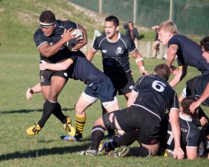 Jeke Maiono (Pirates) runs mid air up the edge of the ruck. Photo by Paul Langley