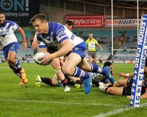 Josh Morris goes over to score for the Bulldogs. Photo Getty Images